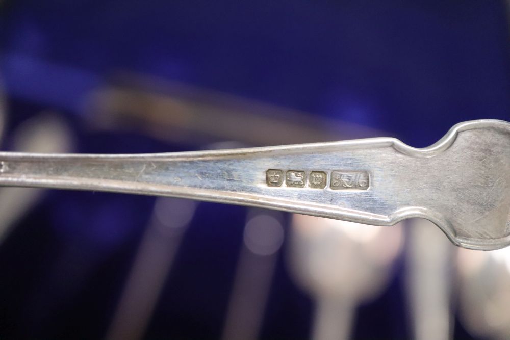 A cased set of six George V silver teaspoons and matching sugar tongs, Sheffield, 1914.